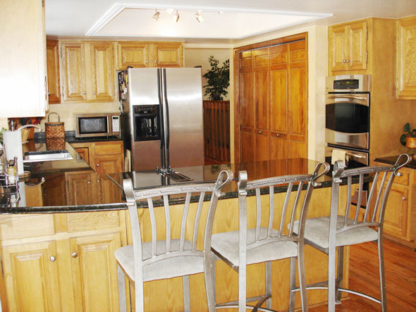 Kitchen with granite countertops and stainless steel appliances
